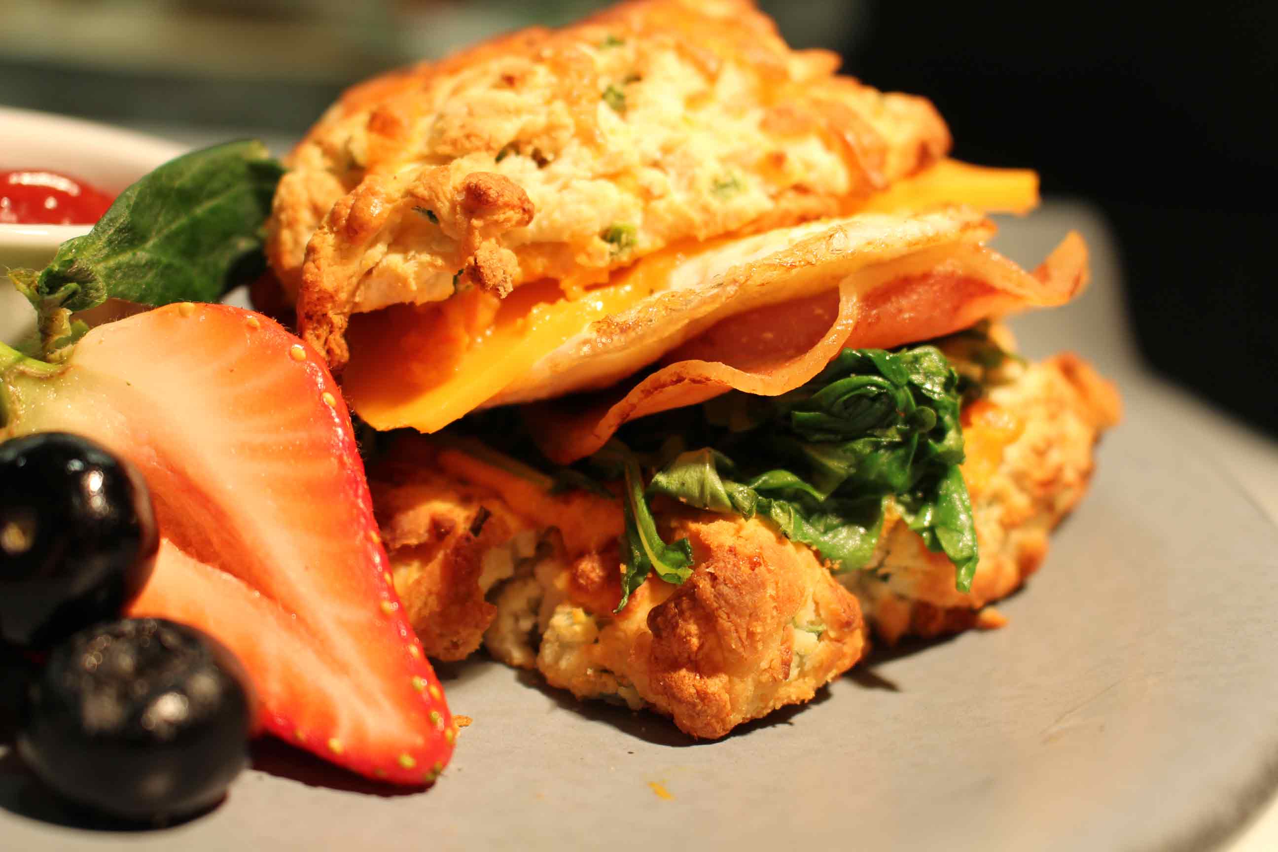 A sandwich made on a cheddar biscuit